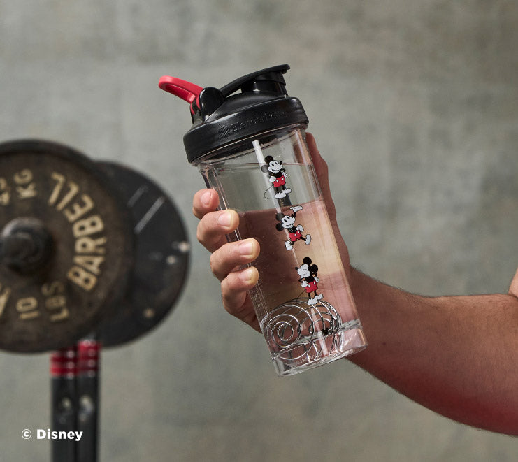 pro-series-d9 Mickey_Mouse_Protein_Shaker_Bottle_Being_Held_In_the_Gym.jpg